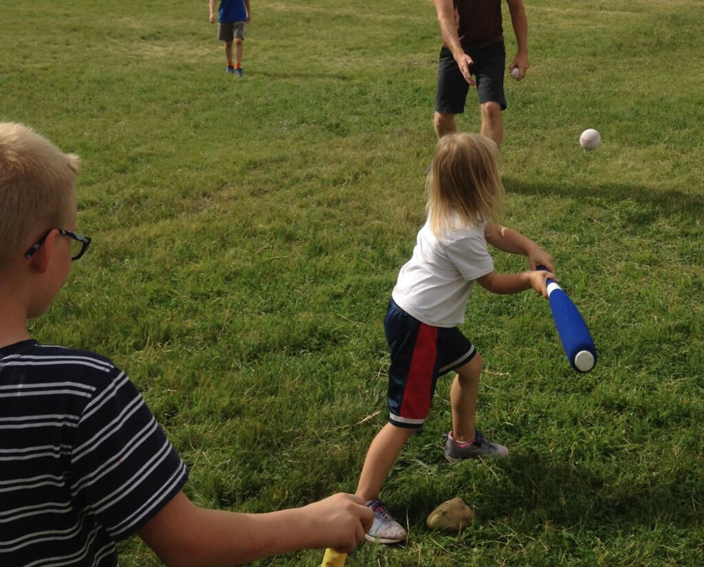 Child swinging a bat